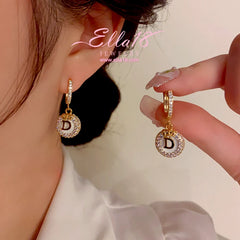 Close-up detail of the sparkling zircons and plating on the Letter D Earrings