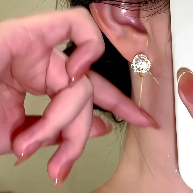 Close-up detail of the sparkling zircons and plating on the Little Hoop Earrings