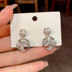 Angled view of the 14K Gold-Plated Luxury Zircon Diamond Petal Geometric Pearl Earrings