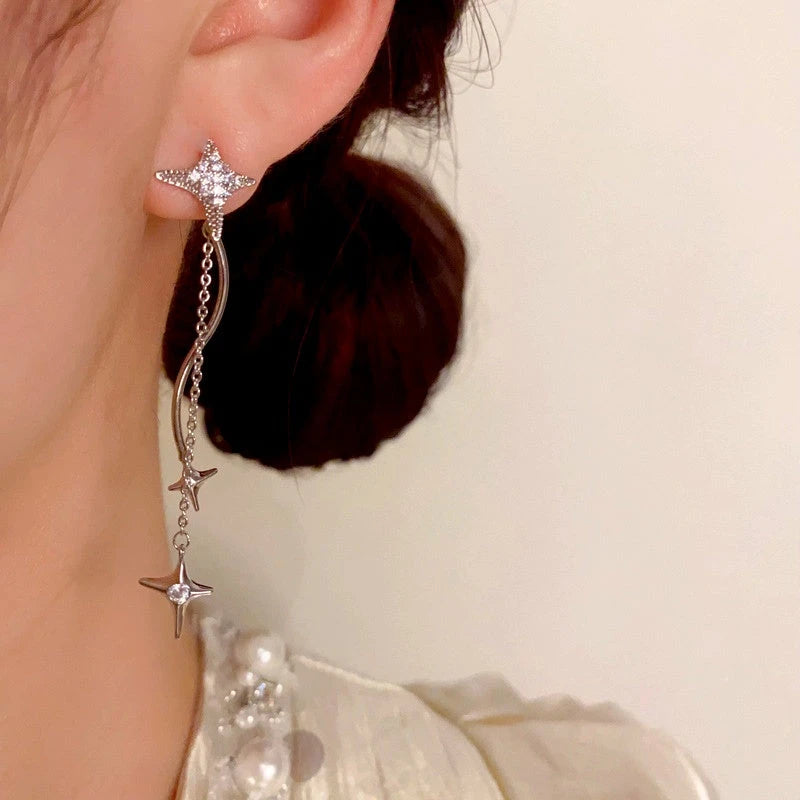 Model showcasing the dangle and style of the 14K Gold-Plated Luxury Zircon Diamond Star Tassel Earrings
