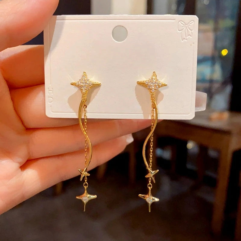 Close-up detail of the sparkling zircons and plating on the Star Tassel Earrings