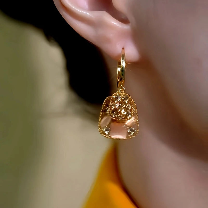 Model showcasing the dangle and style of the 14K Gold-Plated Luxury Zircon Doube-Layer Square Tassel Earrings