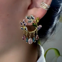 Model showcasing the dangle and style of the 14K Gold-Plated Luxury Zircon Flower Earrings