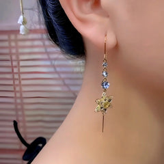 Model showcasing the dangle and style of the 14K Gold-Plated Luxury Zircon Flower Threader Earrings