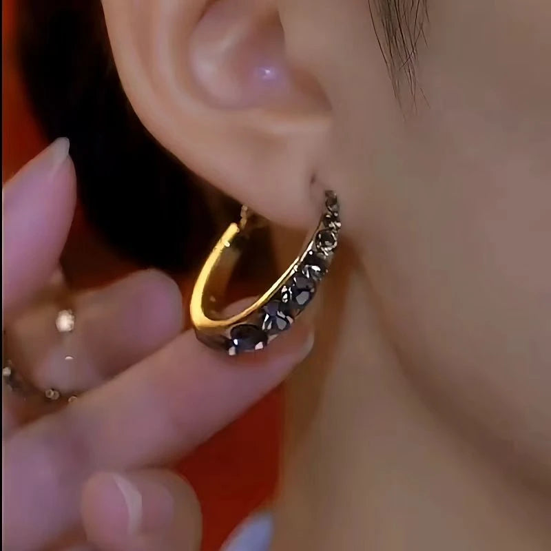 Model showcasing the dangle and style of the 14K Gold-Plated Luxury Zircon Full Diamond Hoop Earrings