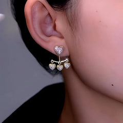 Close-up detail of the sparkling zircons and plating on the Zircon Heart Tassel