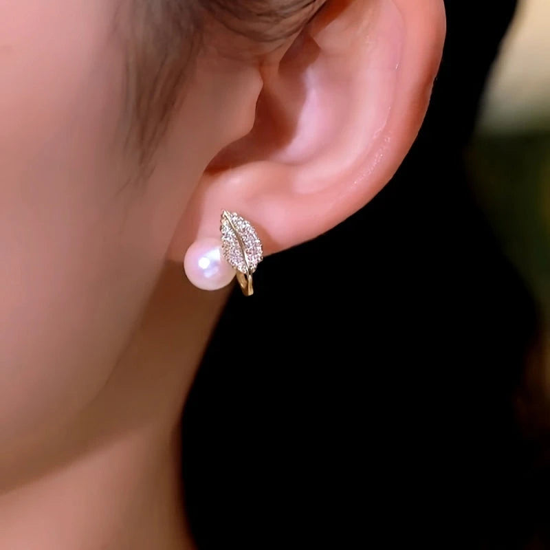Close-up detail of the sparkling zircons and plating on the Leaf Pearl Studs