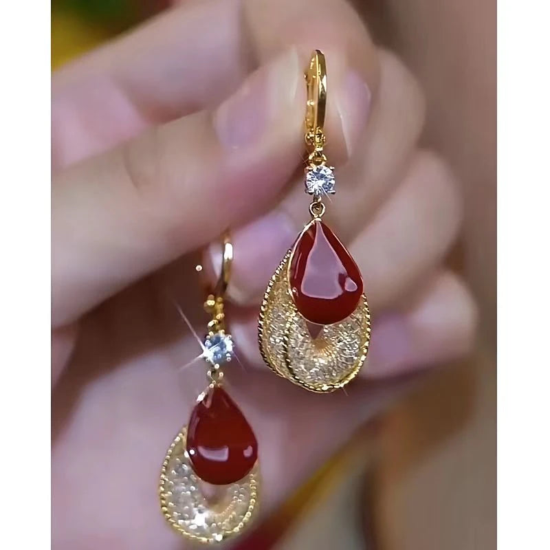 Close-up detail of the sparkling zircons and plating on the Red Oil Drop Earrings