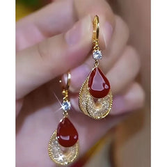 Close-up detail of the sparkling zircons and plating on the Red Oil Drop Earrings