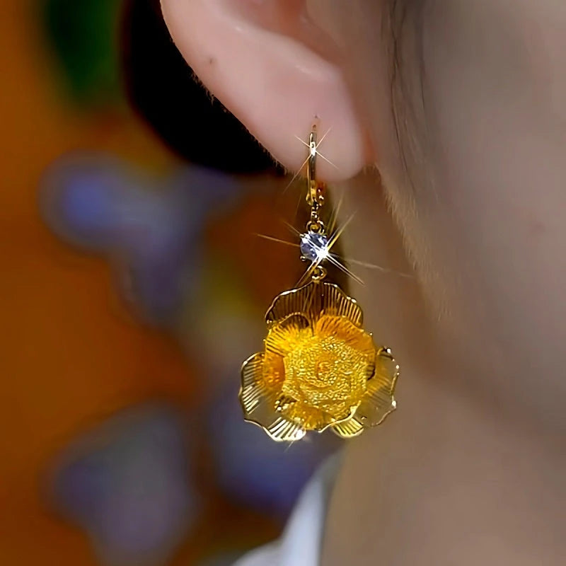 Model showcasing the dangle and style of the 14K Gold-Plated Luxury Zircon Mesh Rose Tassel Earrings
