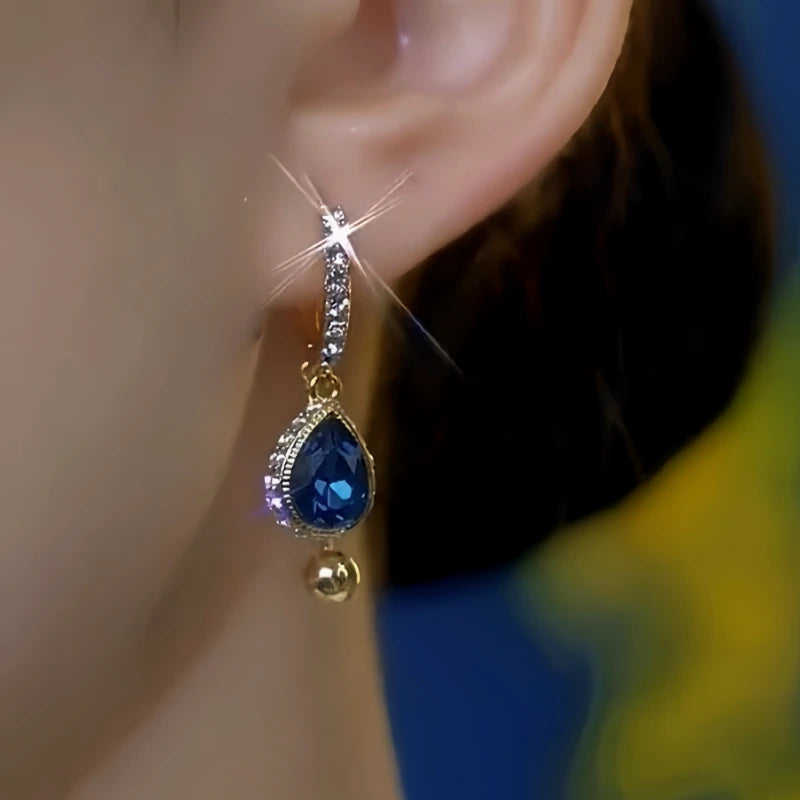 Model showcasing the dangle and style of the 14K Gold-Plated Luxury Zircon Ocean Diamond Tassel Earrings