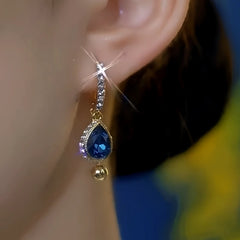 Model showcasing the dangle and style of the 14K Gold-Plated Luxury Zircon Ocean Diamond Tassel Earrings