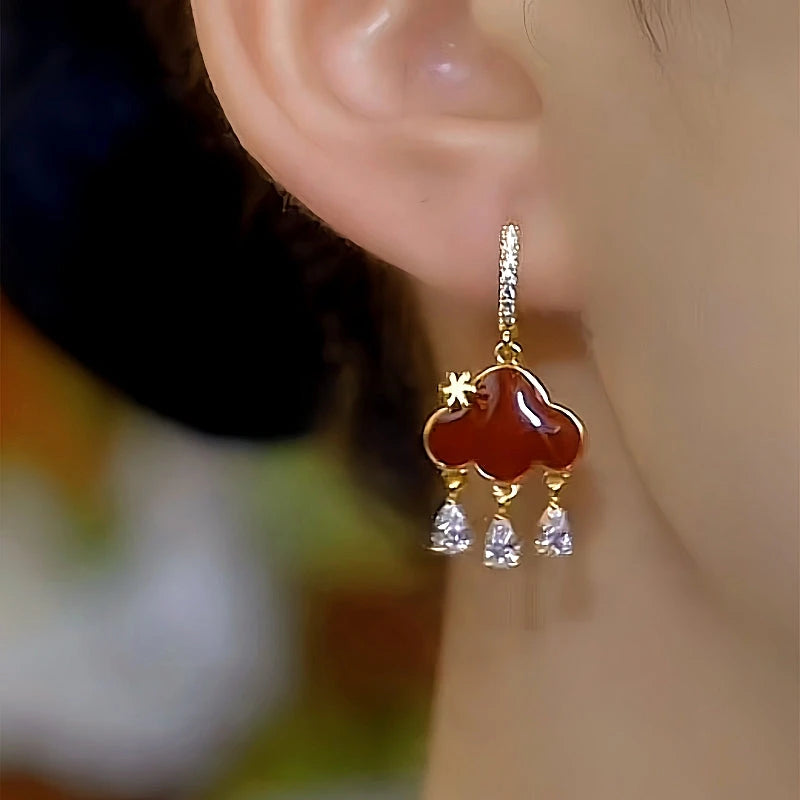 Close-up detail of the sparkling zircons and plating on the Peace Lock Earrings