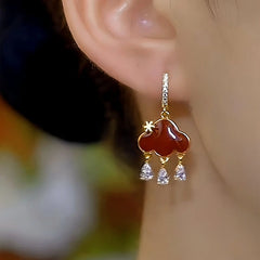 Close-up detail of the sparkling zircons and plating on the Peace Lock Earrings
