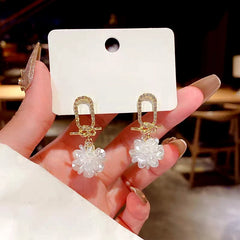Close-up detail of the sparkling zircons and plating on the Petal Tassel Earrings