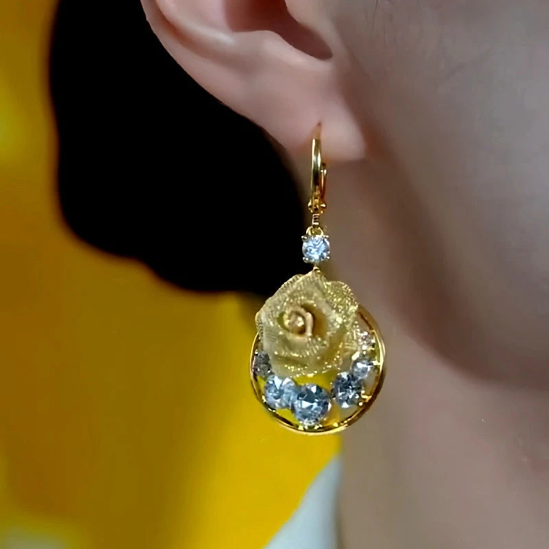 Model showcasing the dangle and style of the 14K Gold-Plated Luxury Zircon Rose Earrings