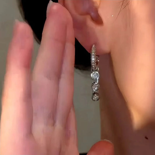 Model showcasing the dangle and style of the 14K Gold-Plated Luxury Zircon Water Drop Earrings