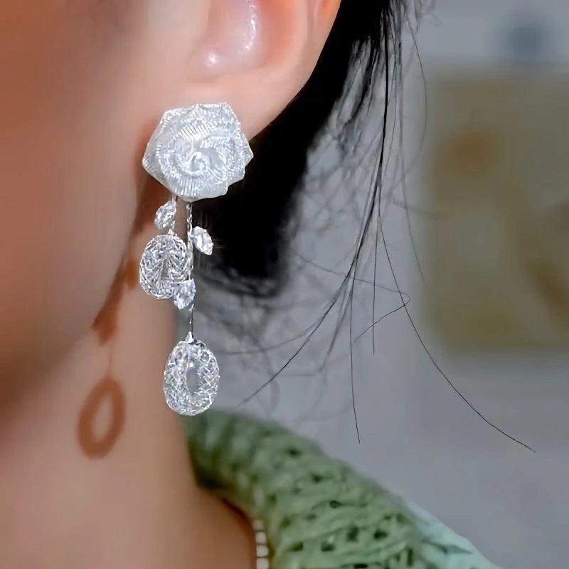 Close-up detail of the sparkling zircons and plating on the Rose Tassel Earrings