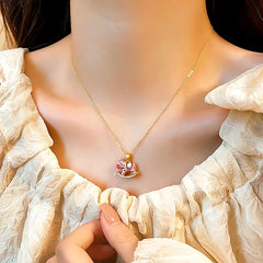 Close-up of the pendant and clasp on the Rocking Horse Necklace