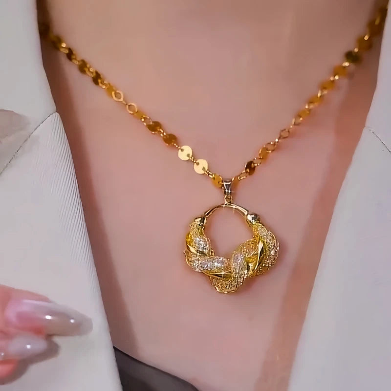 Close-up of the pendant and clasp on the Mesh Ring Necklace