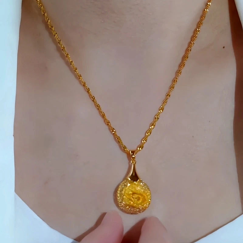 Close-up of the pendant and clasp on the Mesh Rose Necklace