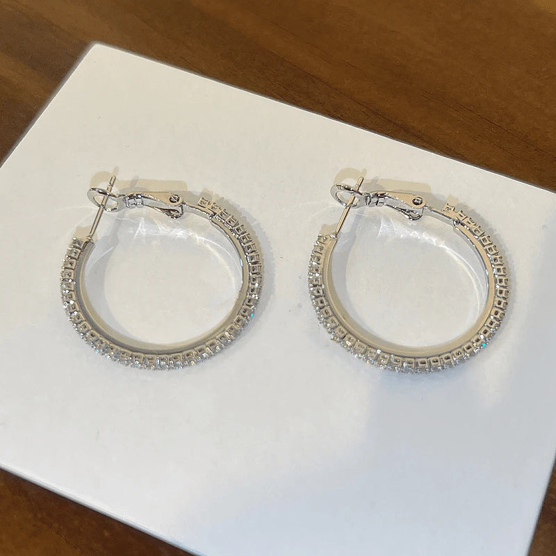 Angled view of the 14K Gold-Plated Micro-Inlaid Zircon Hoop Earrings
