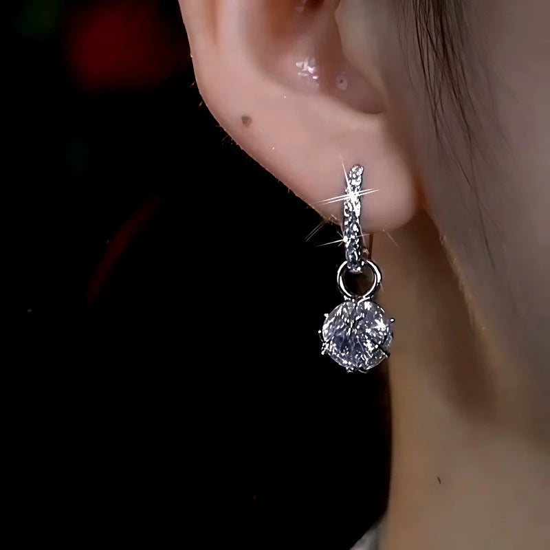 Silver Crystal Drop Huggie Hoop Earring Worn on Woman's Ear