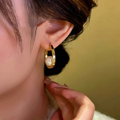 Model showcasing the dangle and style of the 14K Gold-Plated Moon Bead Earrings