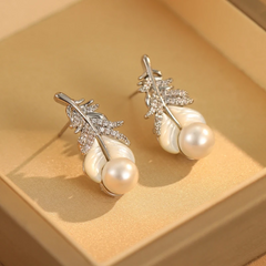 Pair of silver feather cubic zirconia accented white pearl drop earrings