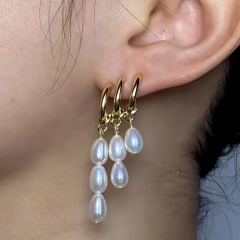 Model showcasing the dangle and style of the 14K Gold-Plated Multi-Layer Pearl Tassel Earrings