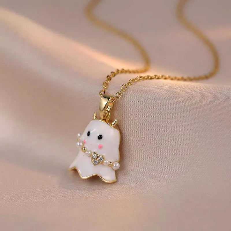 Model showcasing the dangle and style of the 14K Gold-Plated Night Ghost Halloween Earrings And Necklace set