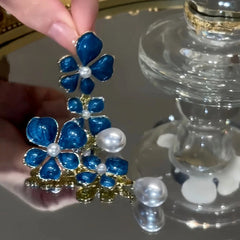 Close-up detail of the sparkling zircons and plating on the Oil Drop Flower