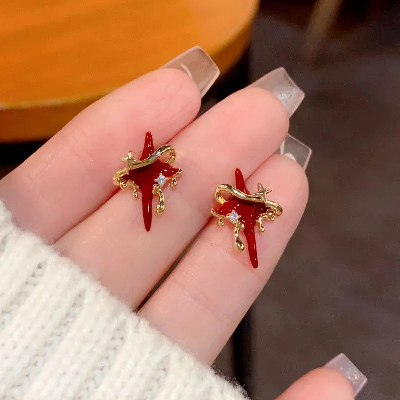 Close-up detail of the sparkling zircons and plating on the Star Stud Earrings