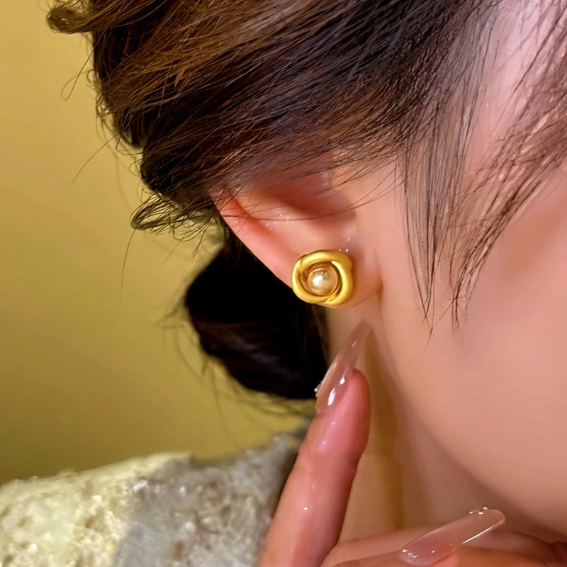 Close-up detail of the sparkling zircons and plating on the Swirl Bead Studs