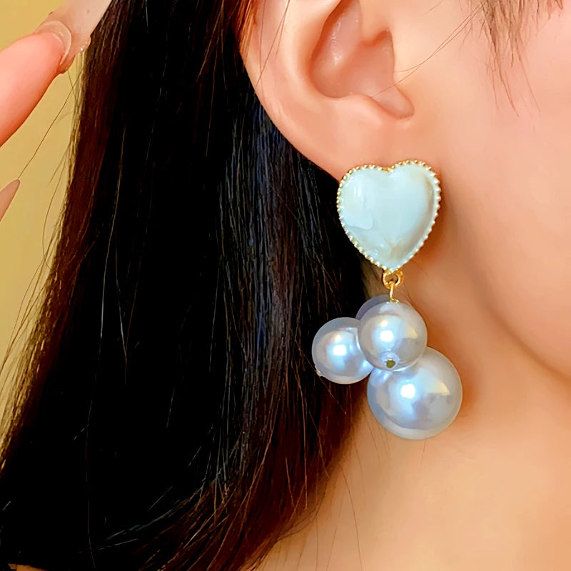 Close-up detail of the sparkling zircons and plating on the Pearl Heart Earrings