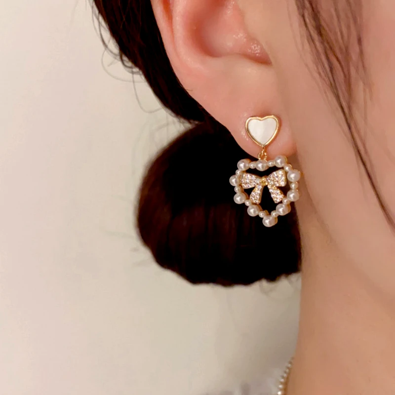Close-up detail of the sparkling zircons and plating on the Pearl Heart Bow