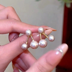 Close-up detail of the sparkling zircons and plating on the Pearl Jacket Earrings