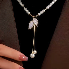 Close-up of the pendant and clasp on the Pearl Leaf Necklace
