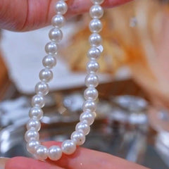Close-up of the pendant and clasp on the Pearl Necklace