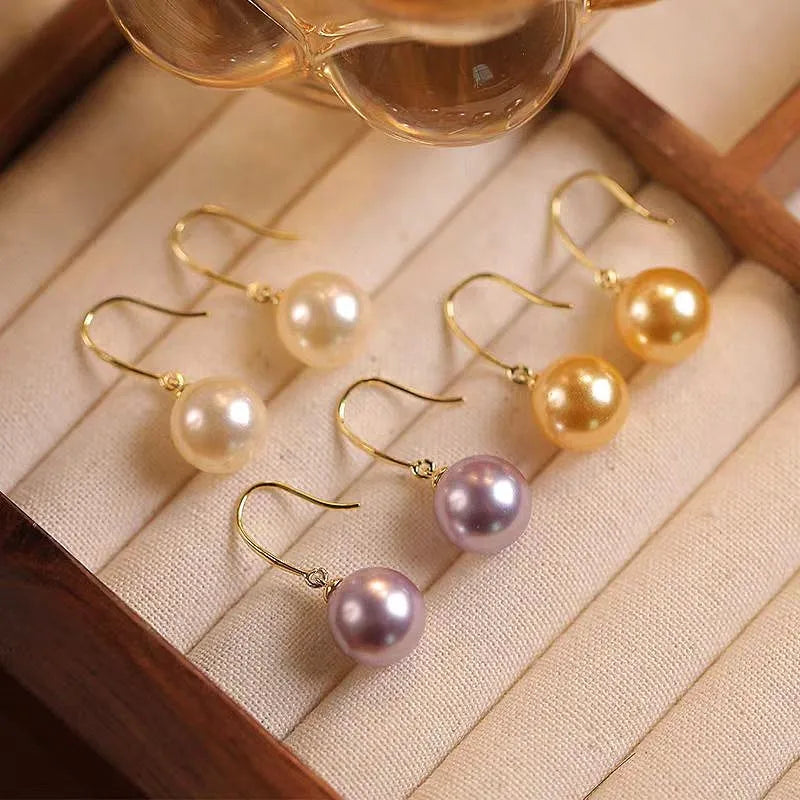 Close-up detail of the sparkling zircons and plating on the Pearl Pendant Earrings