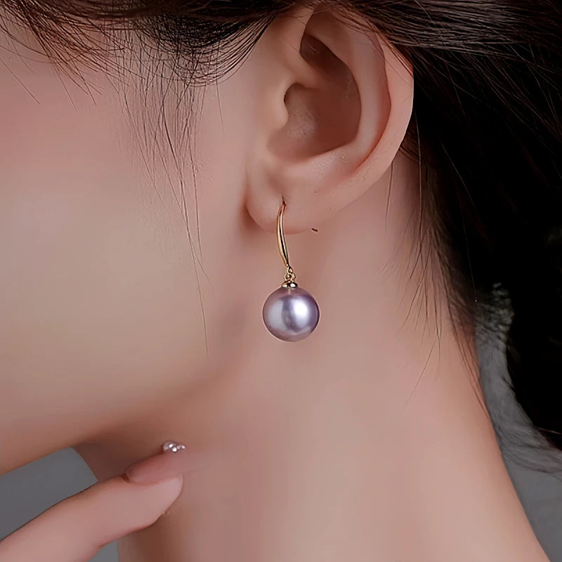 Angled view of the 14K Gold-Plated Pearl Pendant Earrings