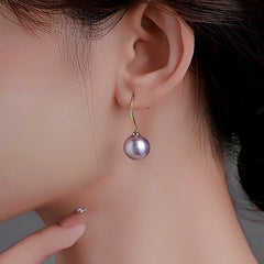 Angled view of the 14K Gold-Plated Pearl Pendant Earrings