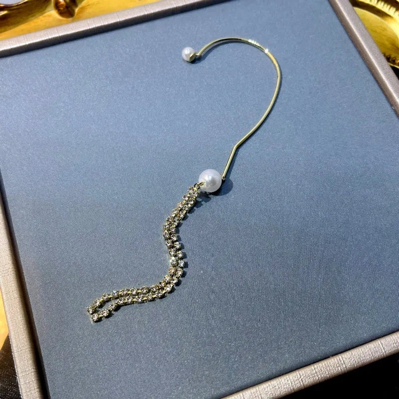 Close-up detail of the sparkling zircons and plating on the Tassel Ear Cuff