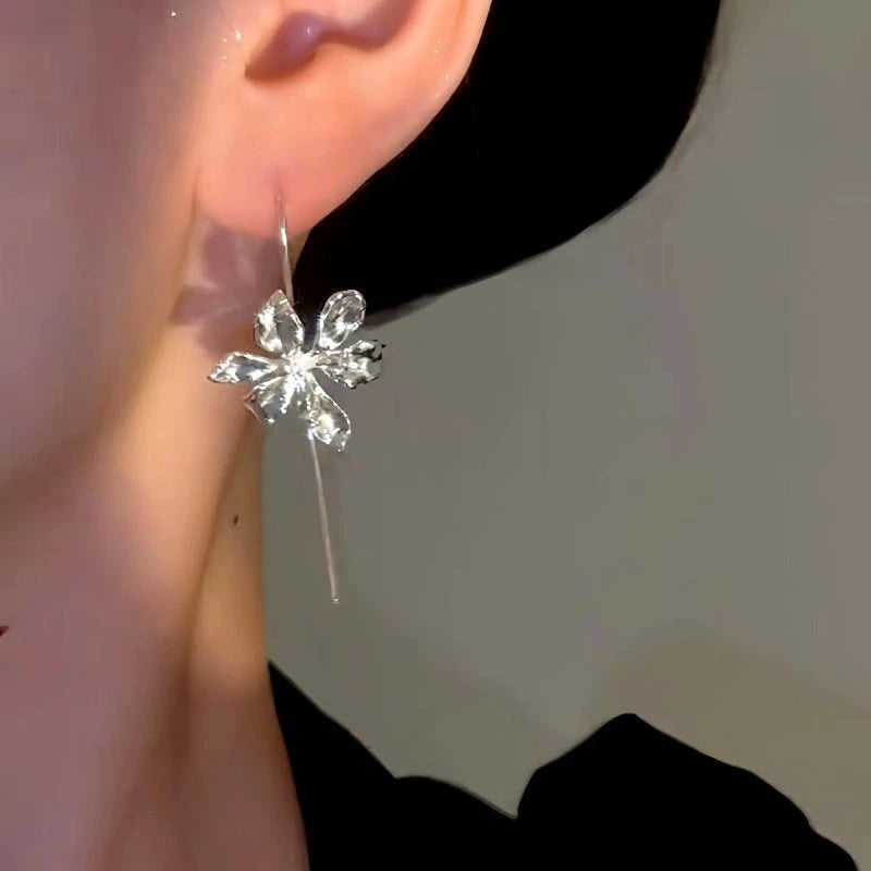 Close-up detail of the sparkling zircons and plating on the Phoenix Iris Earrings