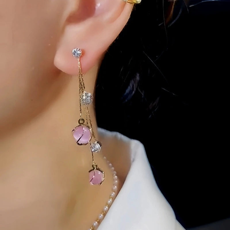 Close-up detail of the sparkling zircons and plating on the Cat's Eye Tassel Earrings