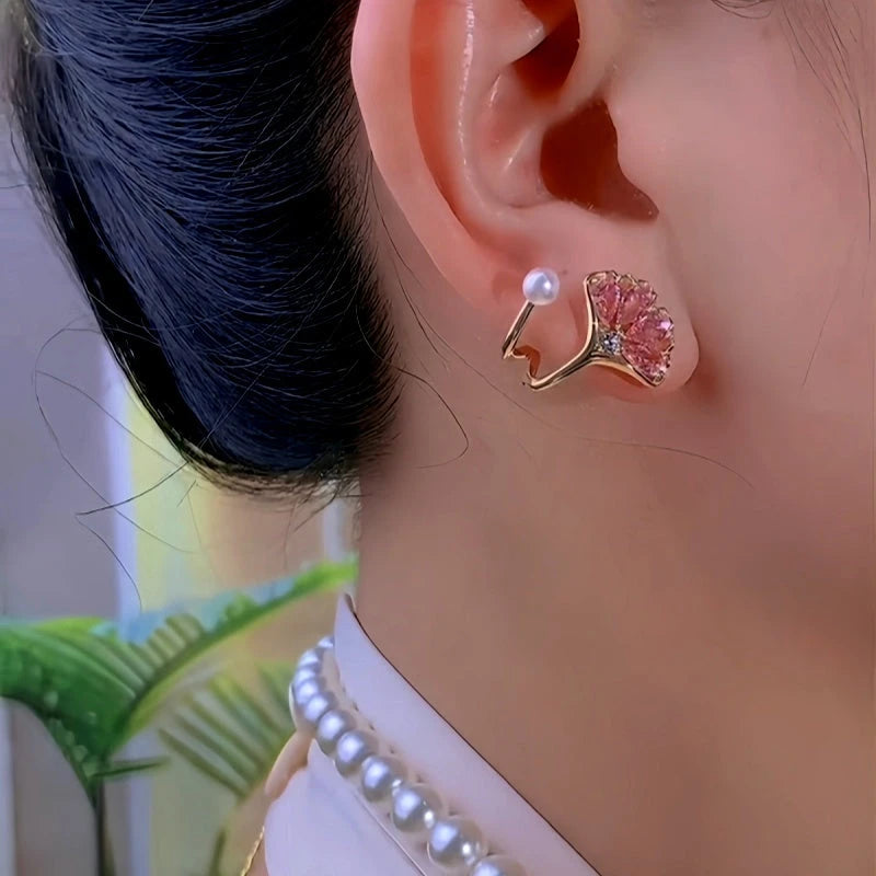 Model showcasing the dangle and style of the 14K Gold-Plated Pink Zircon Ginkgo Leaf Earrings