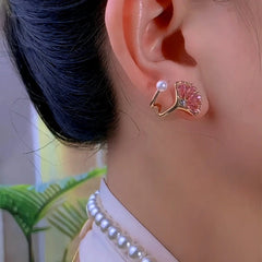 Model showcasing the dangle and style of the 14K Gold-Plated Pink Zircon Ginkgo Leaf Earrings