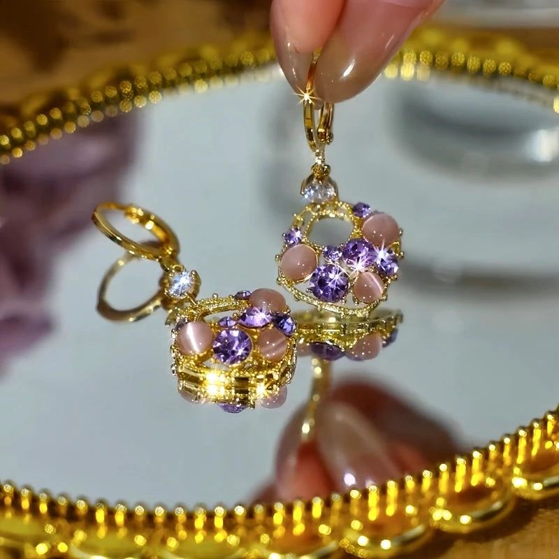 Women's gold tone purple crystal pink cat's eye stone dangle hoop earrings