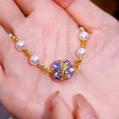 Close-up of the pendant and clasp on the Magnetic Pearl Necklaces