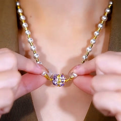 Detailed view of the 14K Gold-Plated Purple Diamond Magnetic Pearl Necklaces chain and pendant
